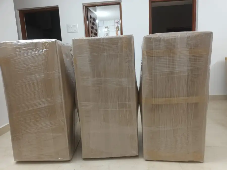 Wardrobes wrapped and sealed by Kerala Road Lines packers before loading